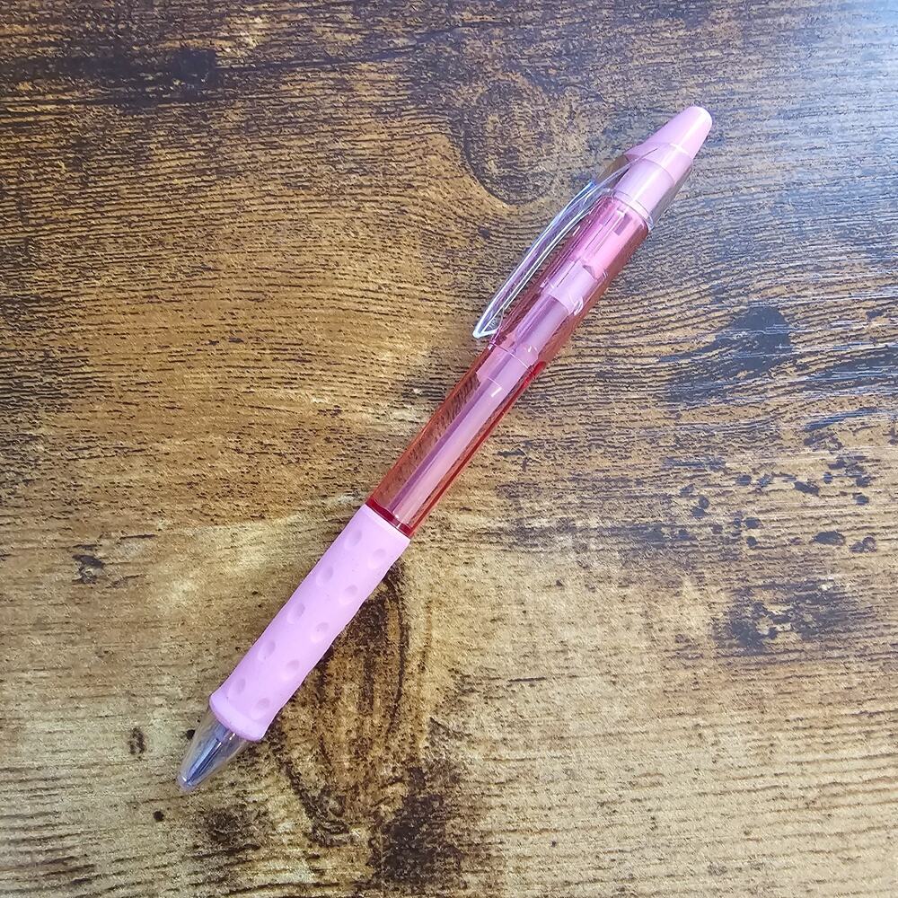 Pentel R.S.V.P. RT retractable ballpoint pen with a pink barrel